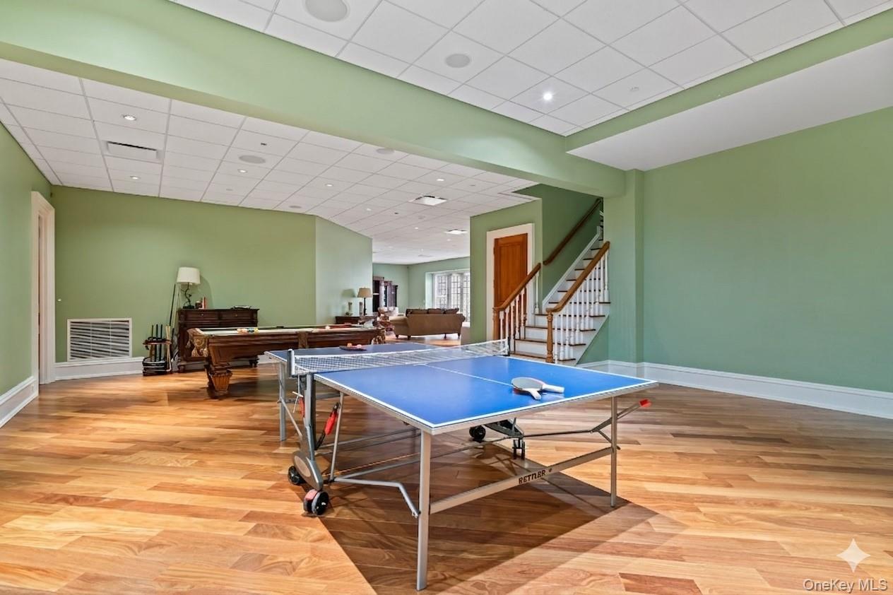 660 Chicken Valley Road Locust Valley, NY 11560 - Photo 39 of 48 a room with table tennis table and windows