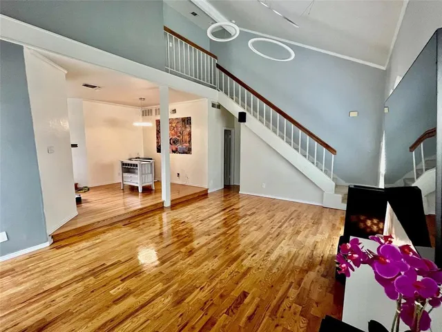 a living room with furniture and flat screen tv