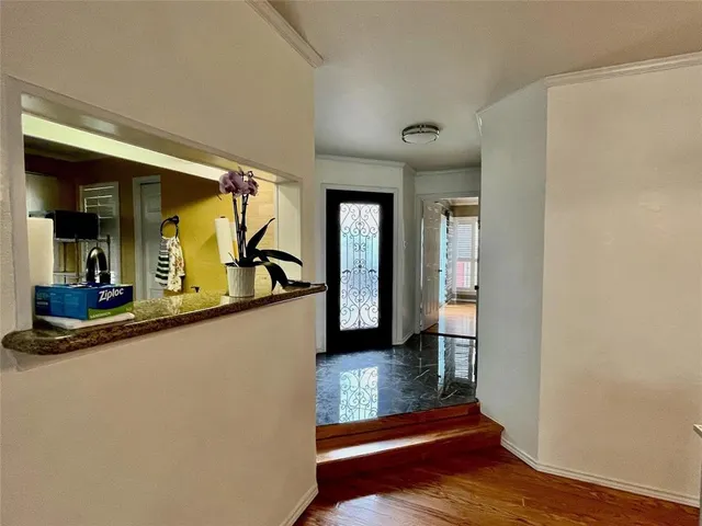 a kitchen with stainless steel appliances a stove microwave and refrigerator