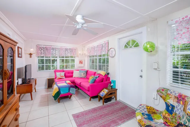 a living room with furniture and flat screen tv