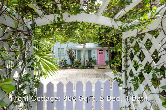 a view of a house with a tree
