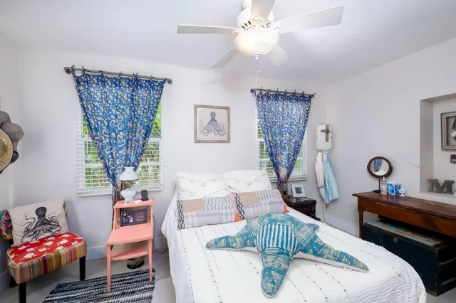 a bedroom with furniture and a window