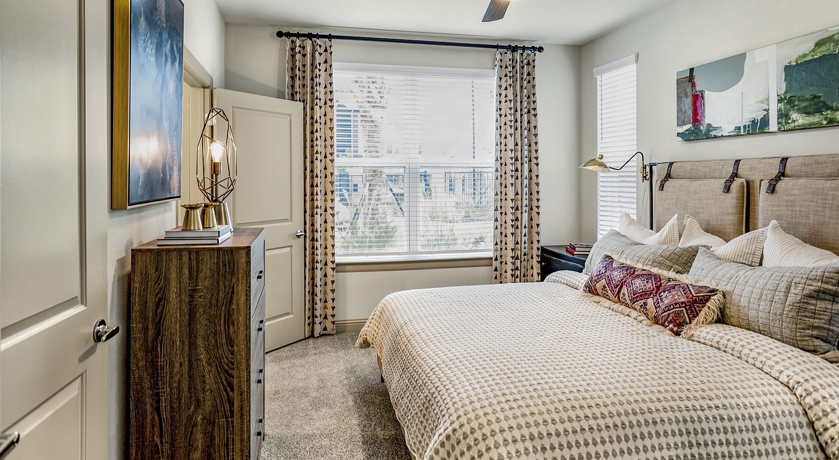 7100 Uvalde Road, Unit 1104 Houston, TX 77049 - Photo 10 of 28 a bedroom with a bed and a mirror