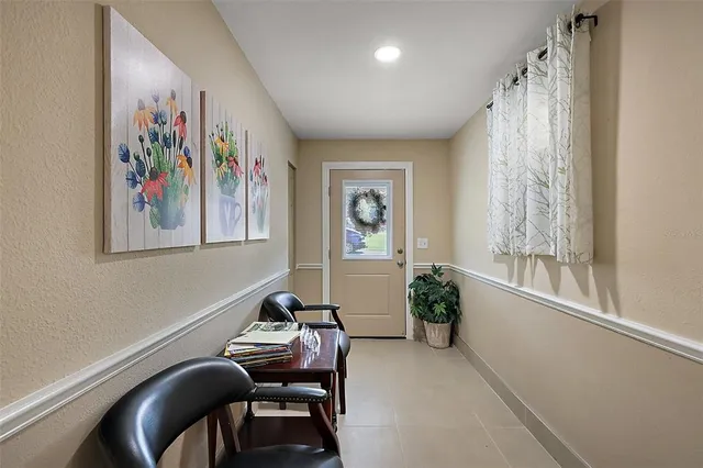 a view of a workspace with furniture