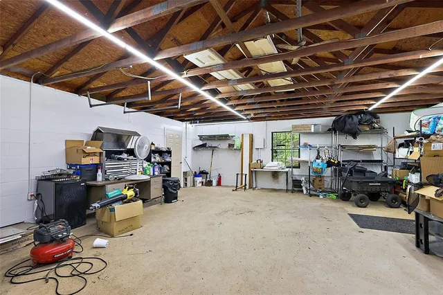 a view of a house with backyard and garden