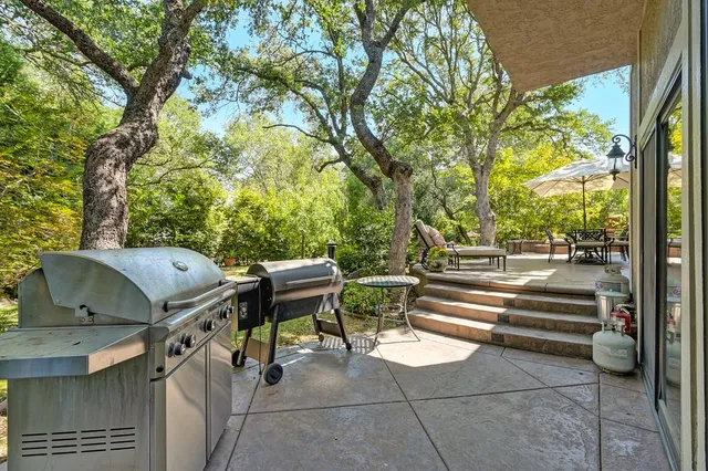 an outdoor space with patio and outdoor seating