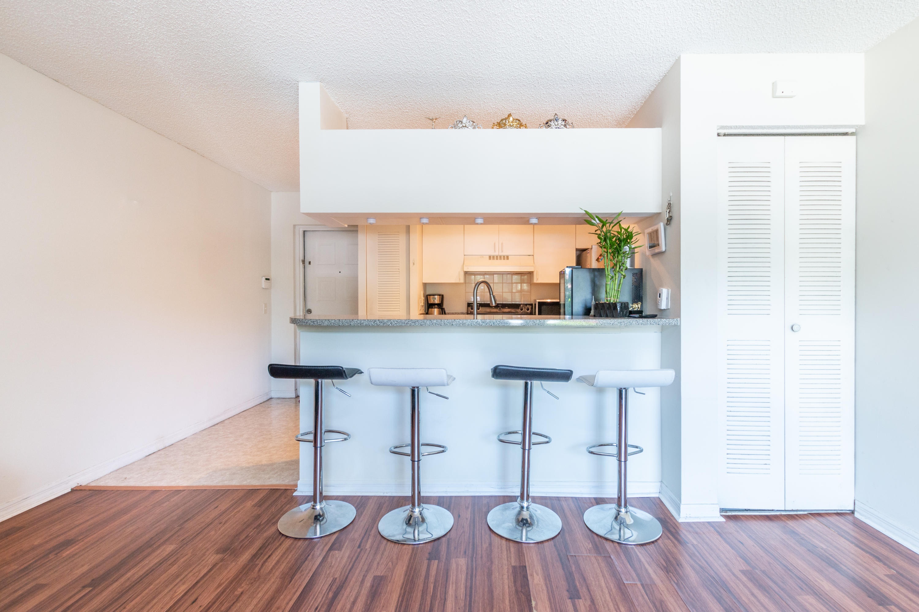 460 South Park Road, Unit 110 Hollywood, FL 33021 - Photo 4 of 17 a view of kitchen with furniture and wooden floor
