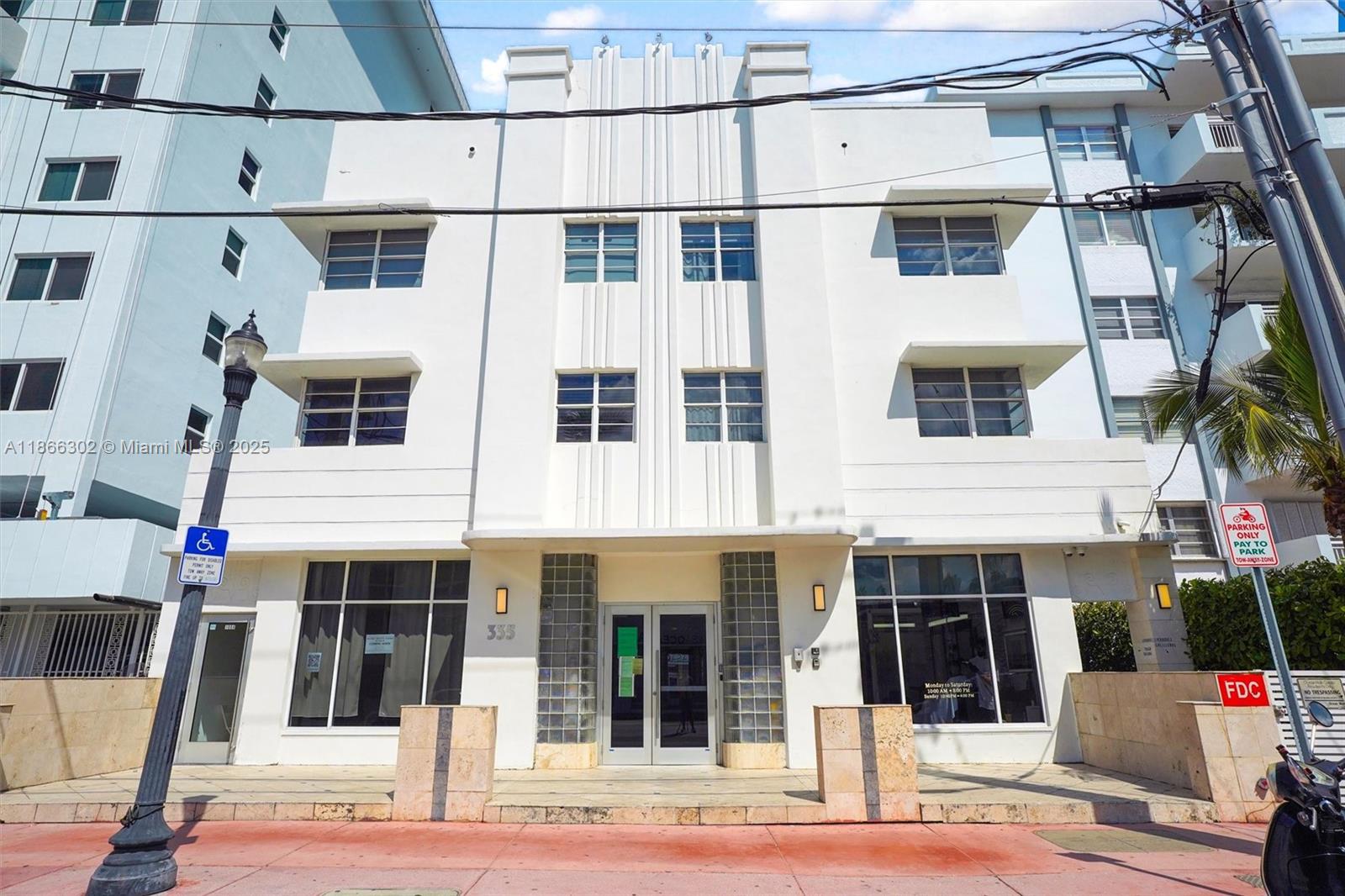 335 Ocean Drive, Unit 111 Miami Beach, FL 33139 - Photo 11 of 23 a view of a building with a bench