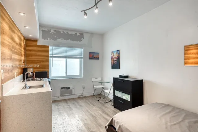 a room with a bed furniture and window