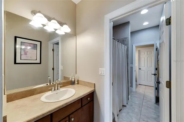 a bathroom with a double vanity sink and a mirror