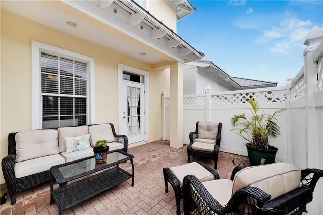 an outdoor space with seating area and barbeque oven