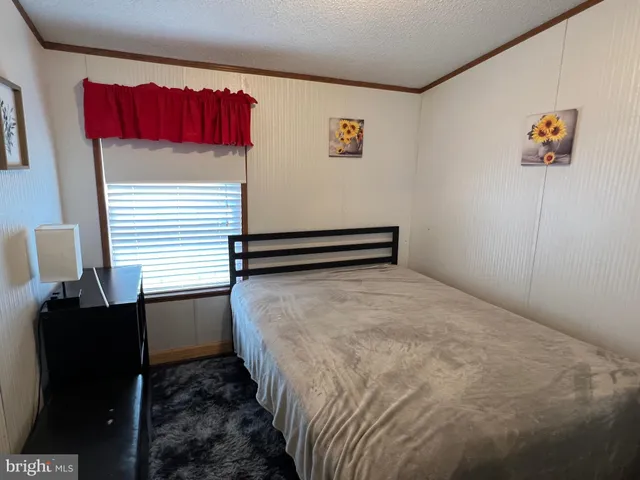 a view of swimming pool with outdoor seating and yard in back