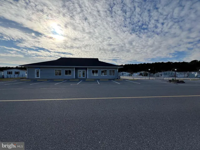a view of a terrace with furniture and city view