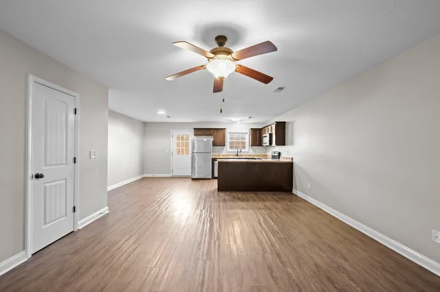 a view of a livingroom with a kitchen