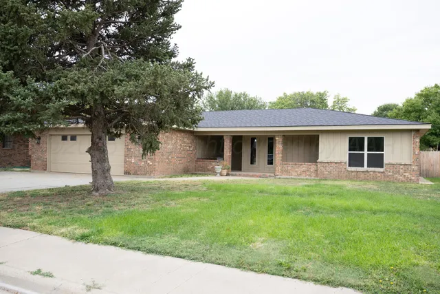 a front view of house with yard and seating area