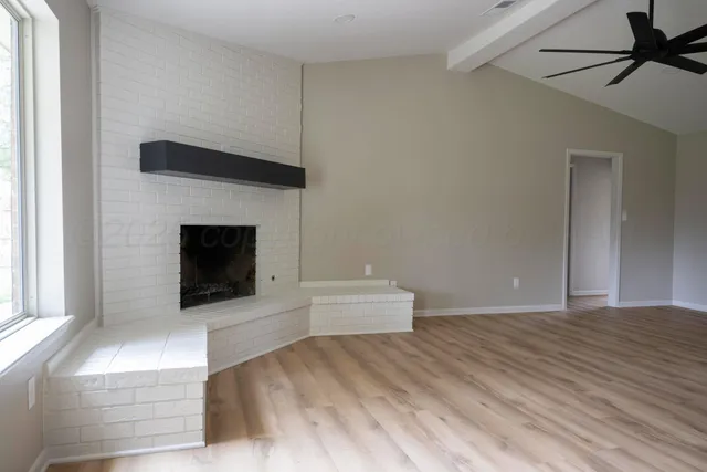 a bedroom with a bed and a fireplace