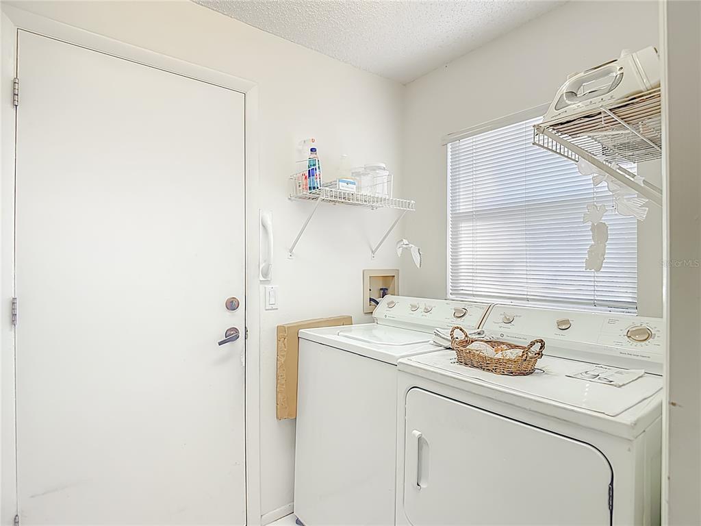 2337 Hidden Trail Drive Spring Hill, FL 34606 - Photo 18 of 24 a bathroom with a sink and a mirror