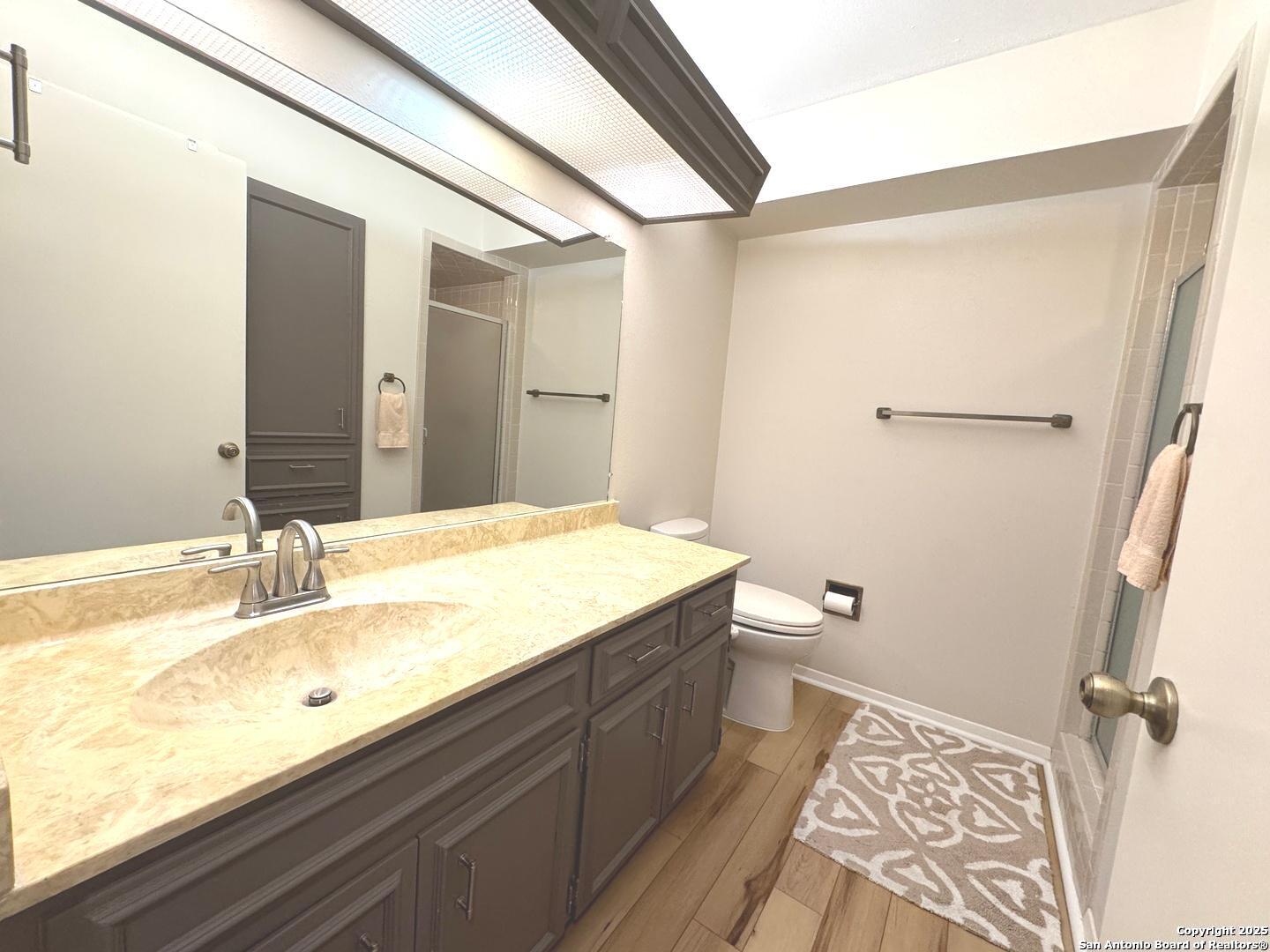 7500 Callaghan, Unit 254 San Antonio, TX 78229 - Photo 15 of 36 a bathroom with a sink and a mirror