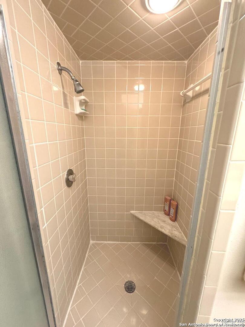 7500 Callaghan, Unit 254 San Antonio, TX 78229 - Photo 18 of 36 a bathroom with a shower