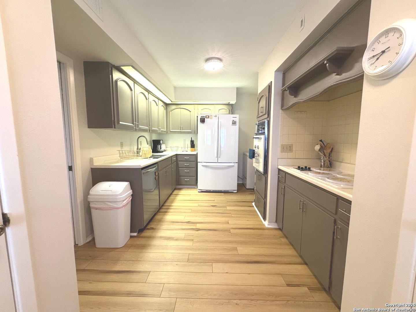 7500 Callaghan, Unit 254 San Antonio, TX 78229 - Photo 19 of 36 a bathroom with a sink a toilet a mirror and vanity