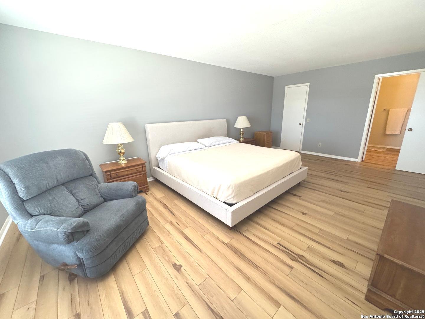 7500 Callaghan, Unit 254 San Antonio, TX 78229 - Photo 28 of 36 a bedroom with a bed and a couch