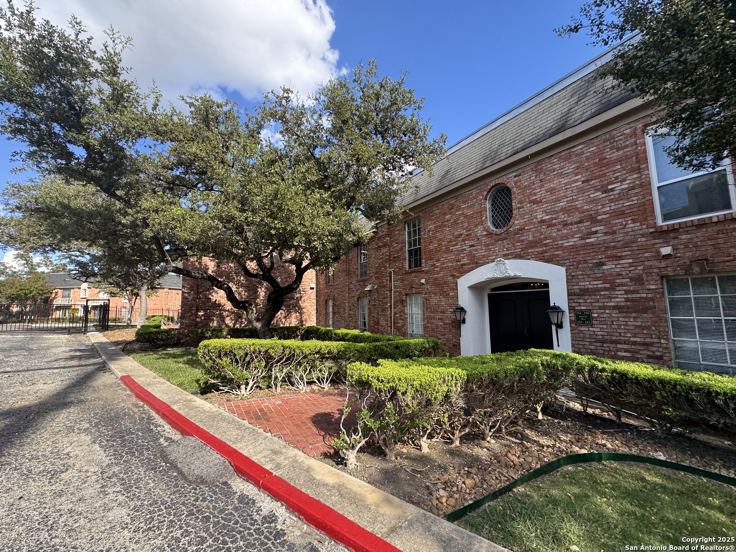 7500 Callaghan, Unit 254 San Antonio, TX 78229 - Photo 3 of 36 a front view of a house with a yard