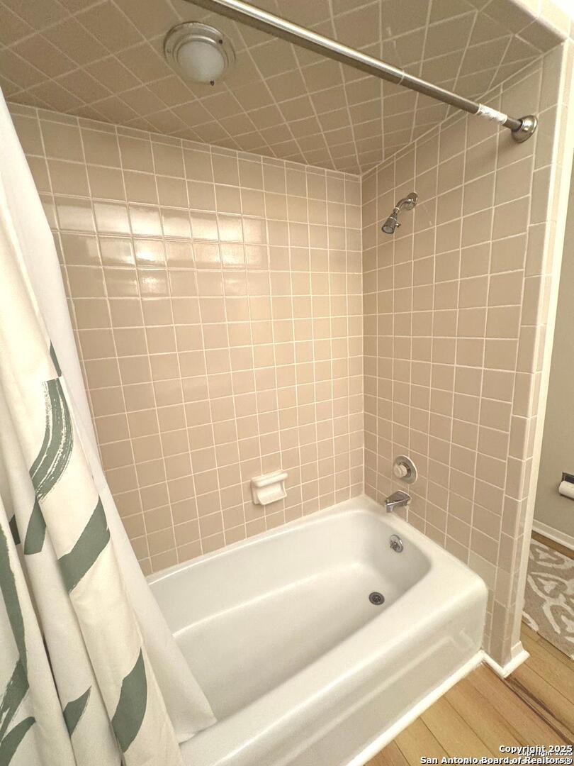 7500 Callaghan, Unit 254 San Antonio, TX 78229 - Photo 35 of 36 a bathroom with a bathtub and a shower
