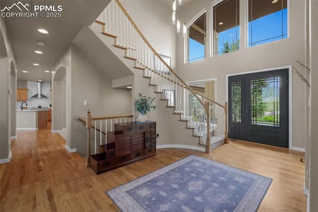 a living room with furniture rug and wooden floor