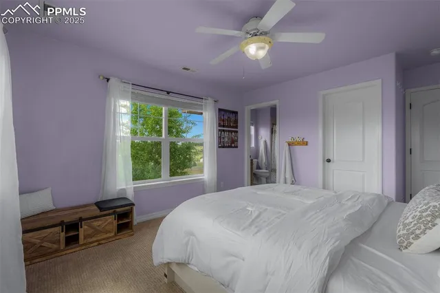 a view of a big house with a big yard and a fountain