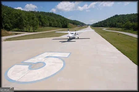 a view of swimming pool with a yard
