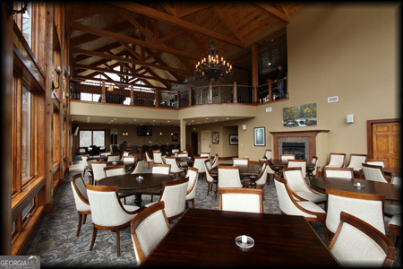 Lot 121 Doolittle Drive Rabun Gap, GA 30568 - Photo 14 of 19 a living room with furniture a chandelier and a floor to ceiling window