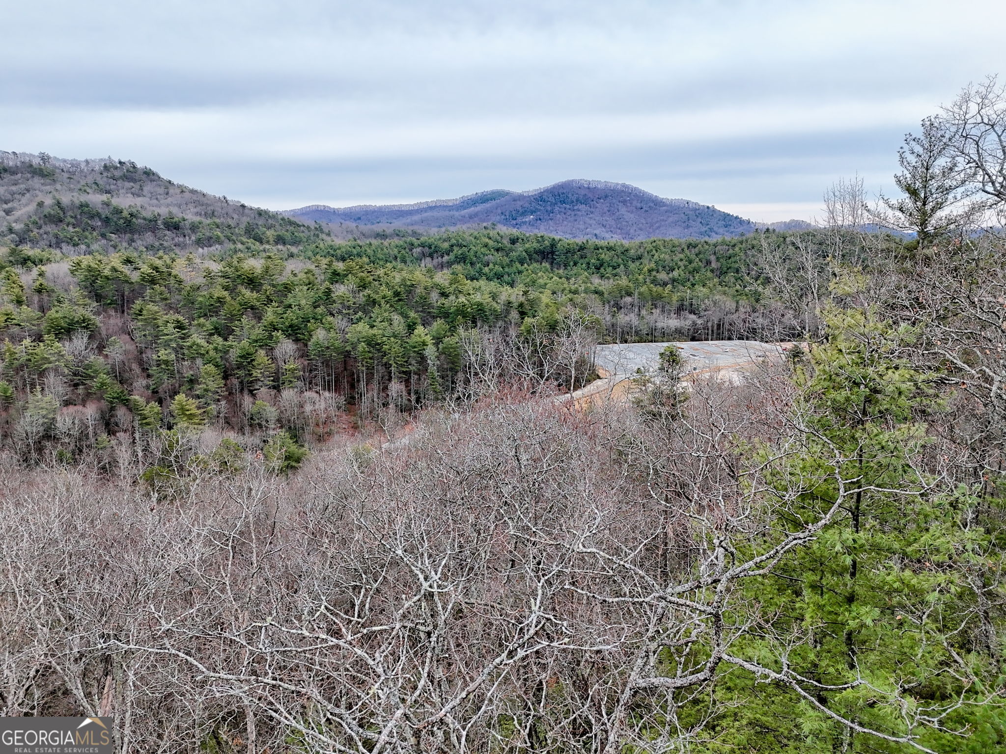 Lot 121 Doolittle Drive Rabun Gap, GA 30568 - Photo 6 of 19 a view of a lake with mountains in the background