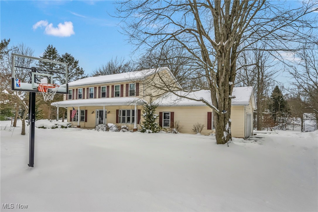 167 Spell Road Kent, OH 44240 - Photo 2 of 48 Colonial-style house with long front porch and 2 car garage, nestled on 2 acres.