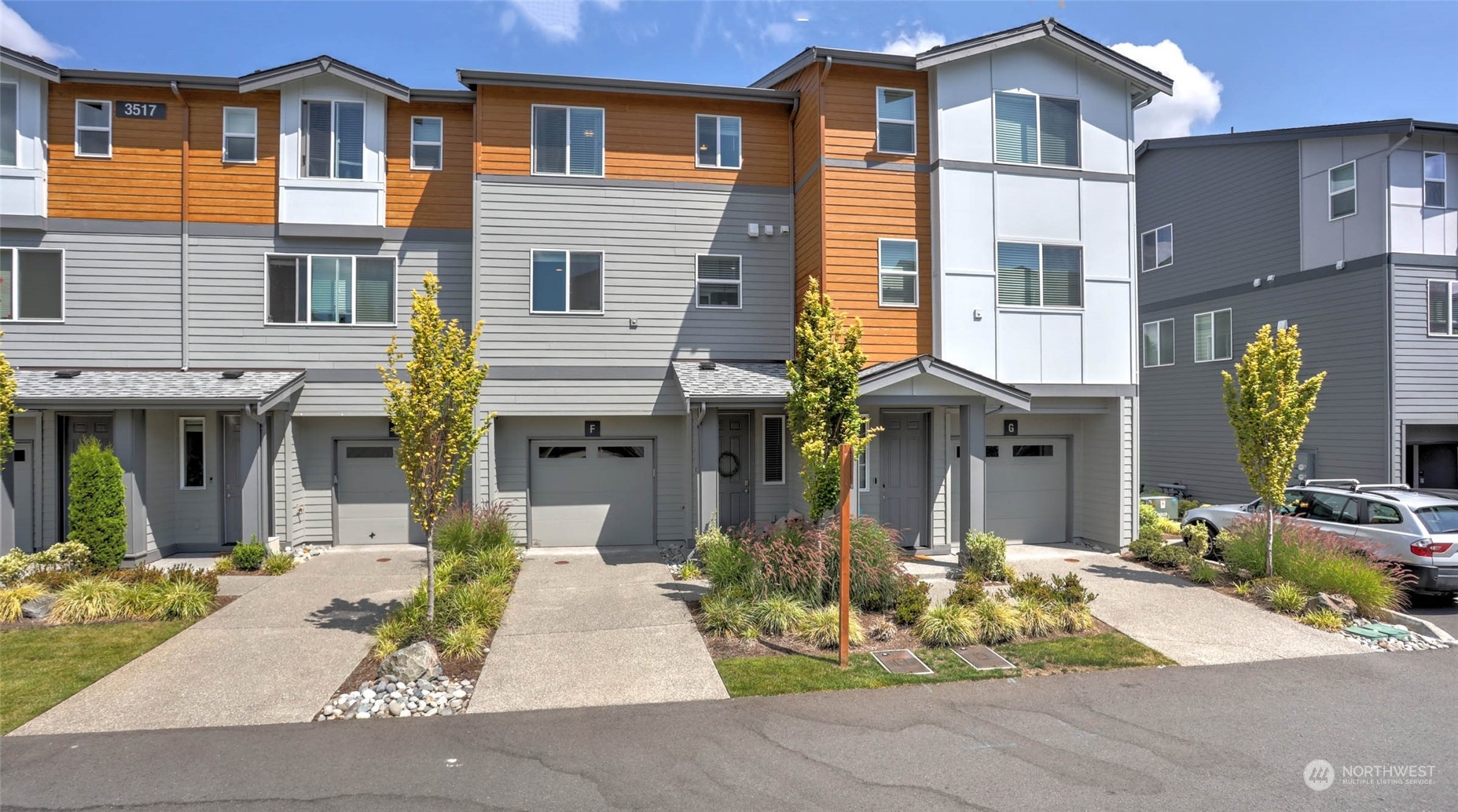 3517 193rd Street Southeast, Unit F Bothell, WA 98012 - Photo 1 of 33 a front view of a house with garden