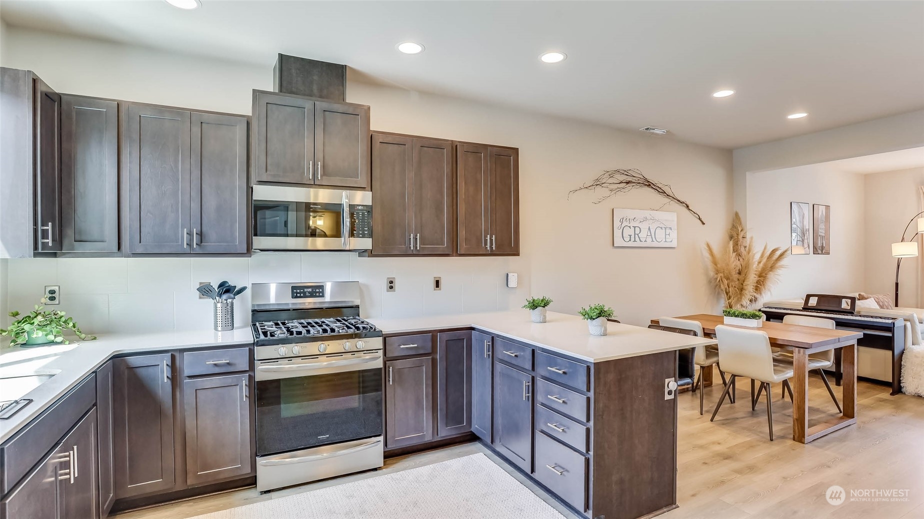 3517 193rd Street Southeast, Unit F Bothell, WA 98012 - Photo 13 of 33 a kitchen with a sink stove and microwave