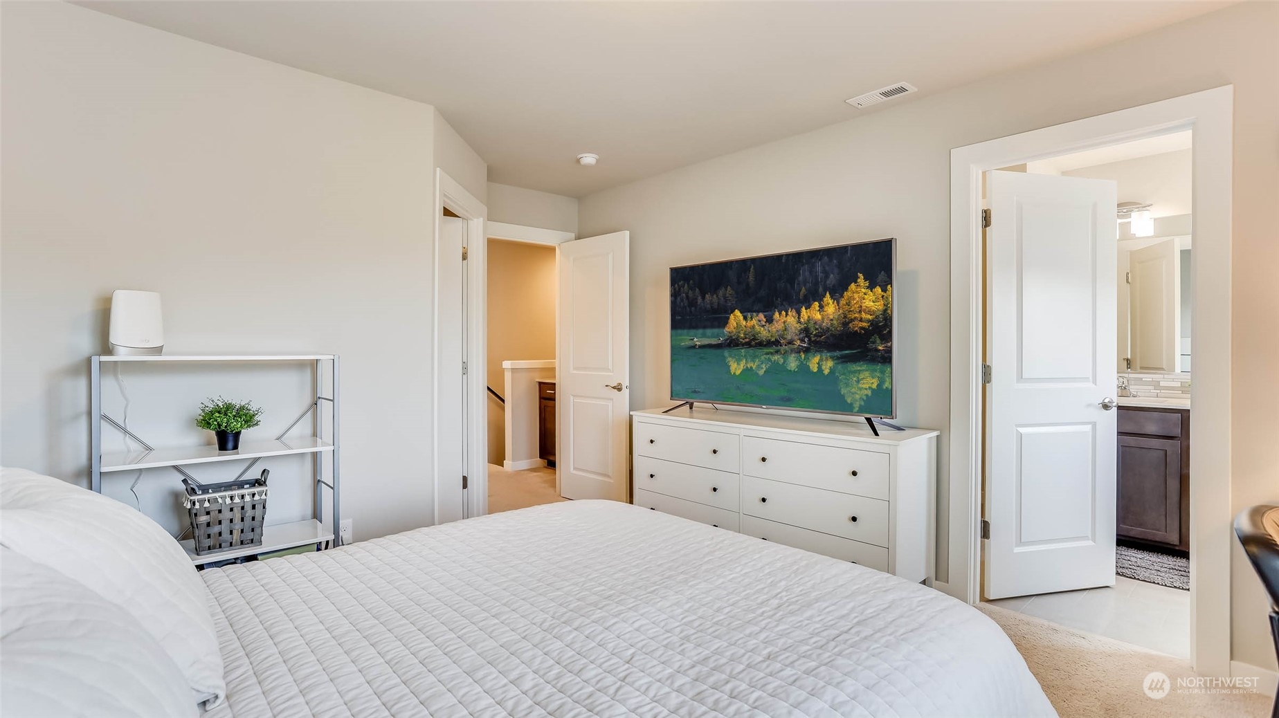 3517 193rd Street Southeast, Unit F Bothell, WA 98012 - Photo 18 of 33 a bedroom with a bed and a flat screen tv