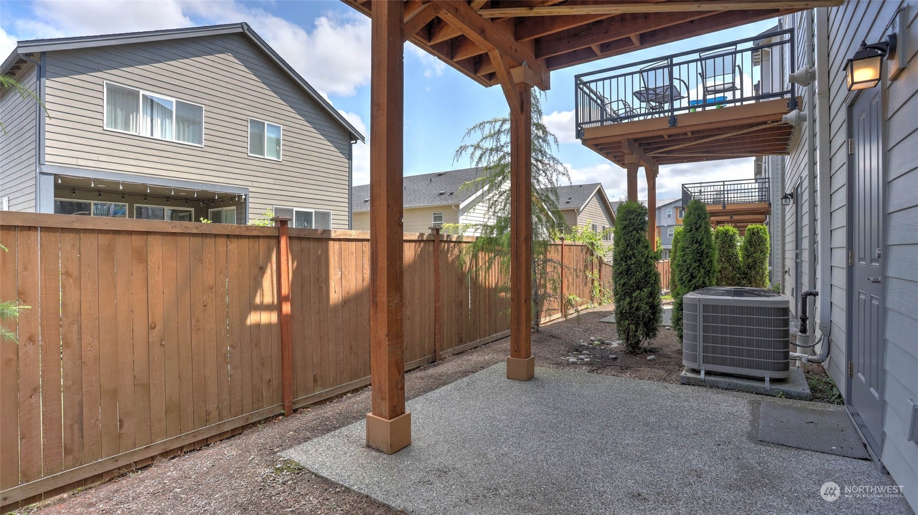 3517 193rd Street Southeast, Unit F Bothell, WA 98012 - Photo 28 of 33 a backyard of a house with barbeque oven table and chairs