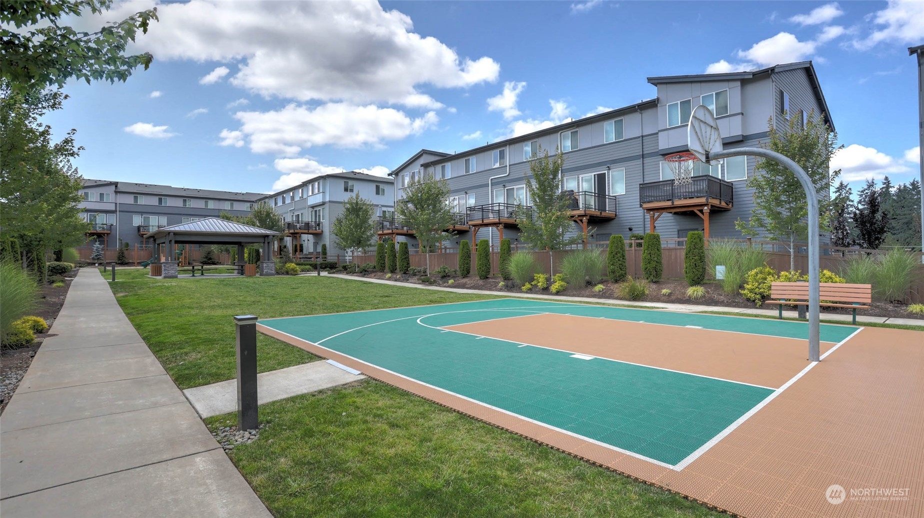 3517 193rd Street Southeast, Unit F Bothell, WA 98012 - Photo 30 of 33 a view of a house with a swimming pool and a yard