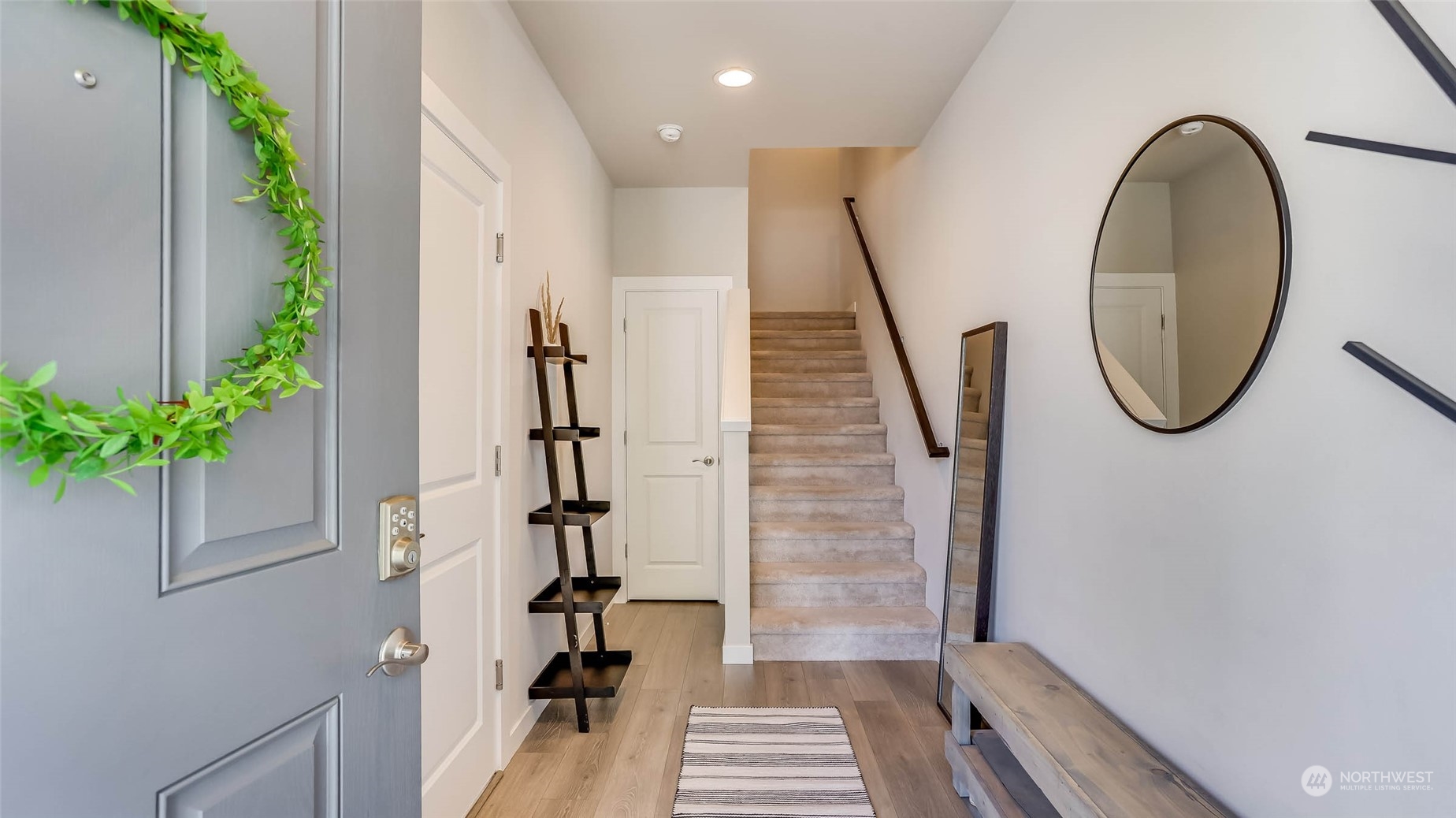 3517 193rd Street Southeast, Unit F Bothell, WA 98012 - Photo 3 of 33 a view of a hallway with wooden floor and entryway