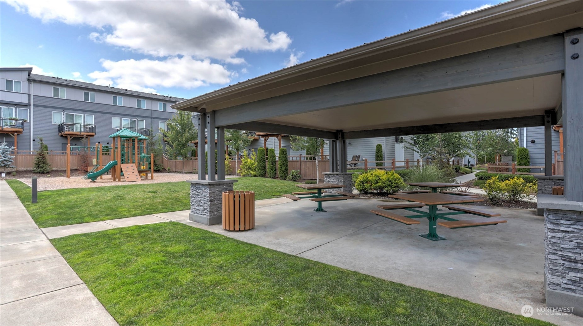3517 193rd Street Southeast, Unit F Bothell, WA 98012 - Photo 31 of 33 a view of a patio with a table chairs and a yard
