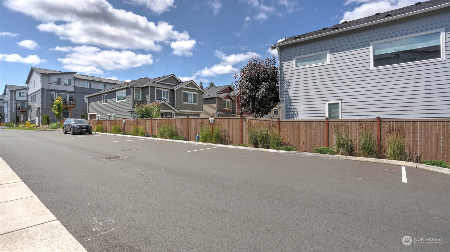 3517 193rd Street Southeast, Unit F Bothell, WA 98012 - Photo 32 of 33 a view of a house with a yard
