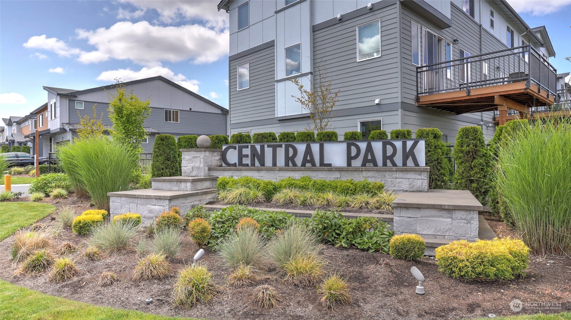 3517 193rd Street Southeast, Unit F Bothell, WA 98012 - Photo 33 of 33 a front view of a house with garden and fountain