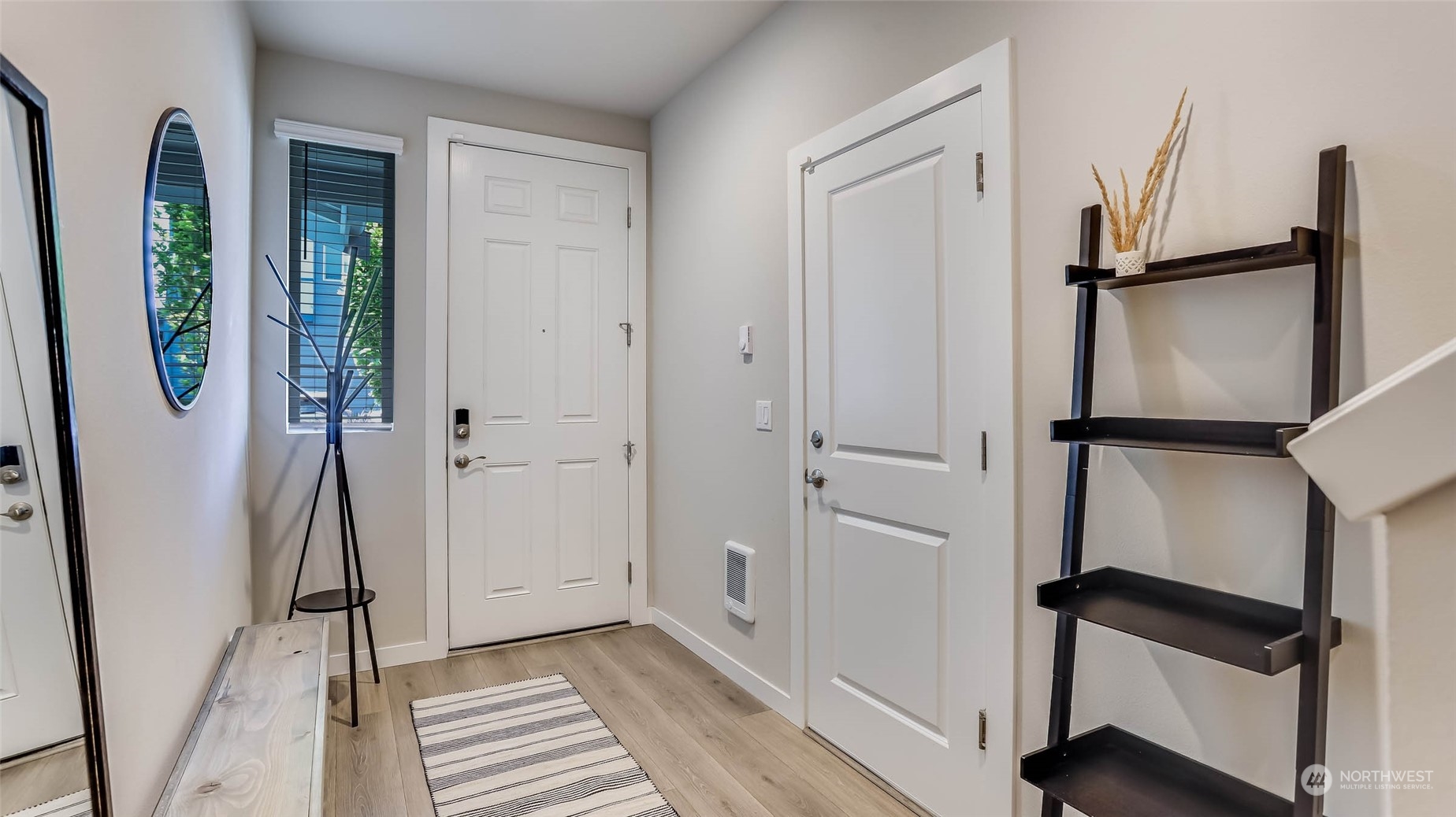 3517 193rd Street Southeast, Unit F Bothell, WA 98012 - Photo 4 of 33 a view of a hallway with wooden floor and staircase