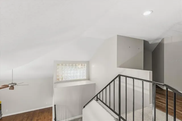 a view of a hallway with windows