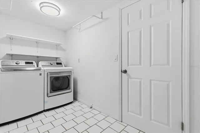 a utility room with dryer and washer