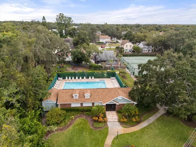 an aerial view of a house with a yard