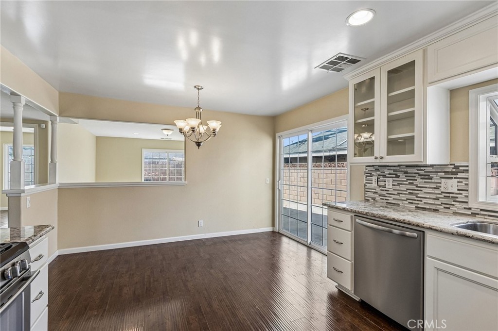 486 South Rall Avenue La Puente, CA 91746 - Photo 13 of 42 a view of a kitchen with wooden floor and iron cabinets