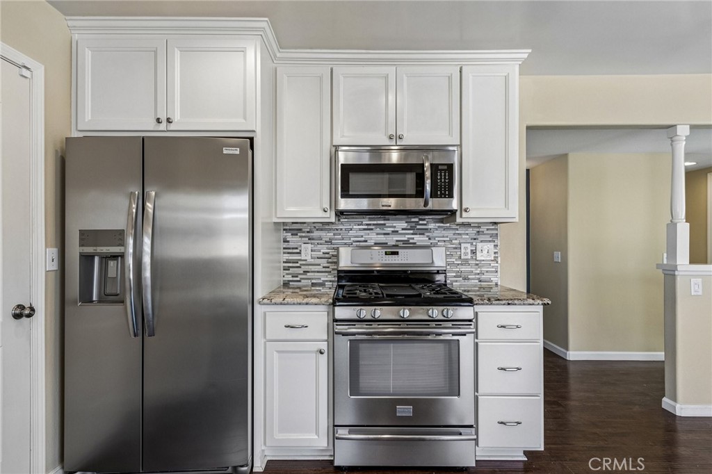 486 South Rall Avenue La Puente, CA 91746 - Photo 17 of 42 a kitchen with cabinets stainless steel appliances and a counter space