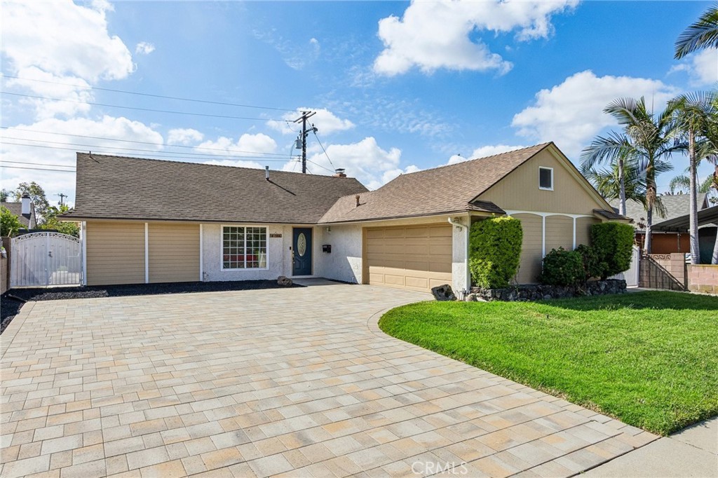 486 South Rall Avenue La Puente, CA 91746 - Photo 2 of 42 a front view of a house with a yard and garage