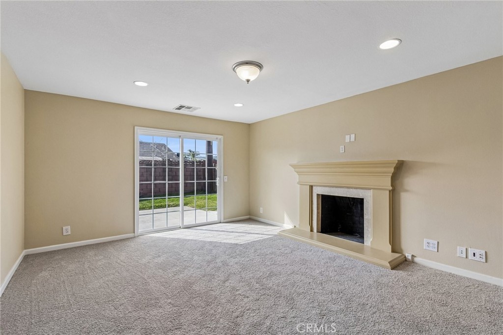 486 South Rall Avenue La Puente, CA 91746 - Photo 5 of 42 a view of an empty room with a fireplace and a window